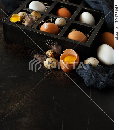 Chicken and quail eggs in a box Chicken and quail eggs in a box 50473663