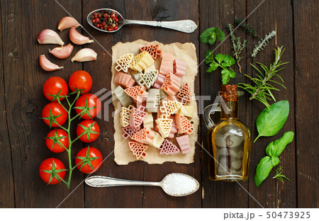 Tricolor pasta, vegetables and herbs 50473925