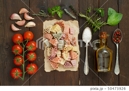 Tricolor pasta, vegetables and herbs Tricolor pasta, vegetables and herbs 50473926