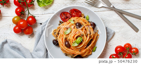 Spaghetti with tomato sauce olives and capers Spaghetti with tomato sauce olives and capers 50476230