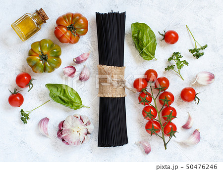 Raw squid ink pasta and vegetables 50476246