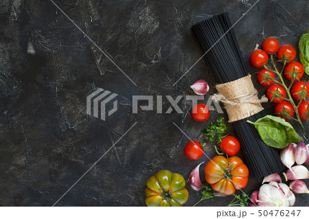Raw squid ink pasta and vegetables 50476247