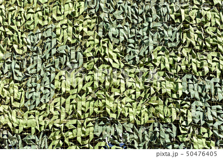 Military camouflage net as background 50476405
