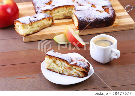Classic American Homemade apple pie. Piece of tasty Organic Apple Pie and cup with espresso coffee Classic American Homemade apple pie. Piece of tasty Organic Apple Pie and cup with espresso coffee 50477677