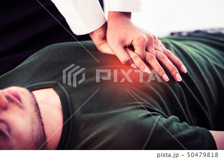 Rescuer hands doing CPR on heart attacked man. Rescuer hands doing CPR on heart attacked man. 50479818