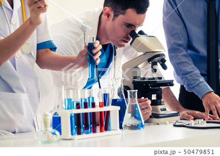 Group of scientists working in chemical lab. Group of scientists working in chemical lab. 50479851