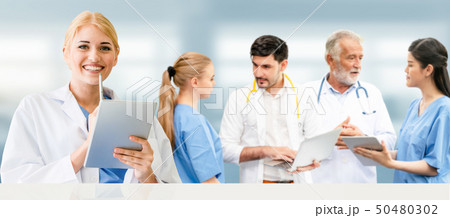 Doctor working in hospital with other doctors. 50480302