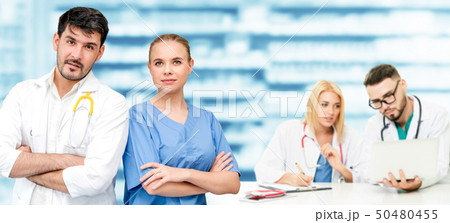 Doctor working in hospital with other doctors. Doctor working in hospital with other doctors. 50480455