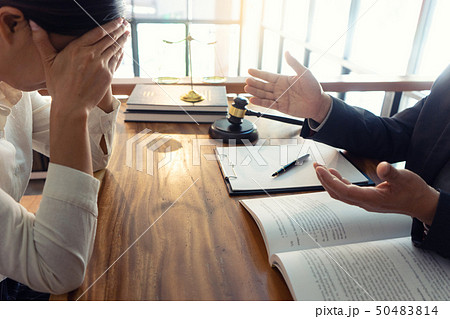 Judge or lawyer talking with client who feel sad Judge or lawyer talking with client who feel sad 50483814