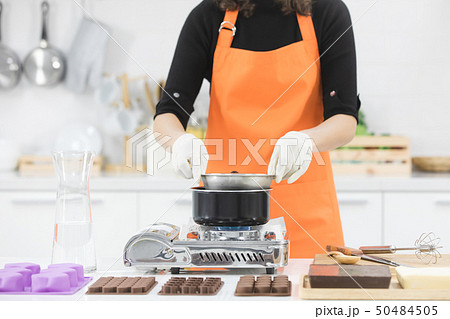 Woman making chocolate Woman making chocolate 50484505