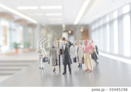 mni figure people walking in the office corridor. mni figure people walking in the office corridor. 50485296