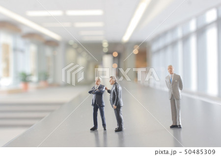 mni figure people walking in the office corridor. mni figure people walking in the office corridor. 50485309