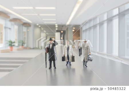 mni figure people walking in the office corridor. 50485322