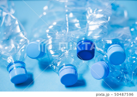 Crumpled plastic bottles of mineral water. 50487596