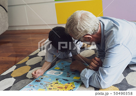 senior man happiness and grandson are sitting on senior man happiness and grandson are sitting on 50490358