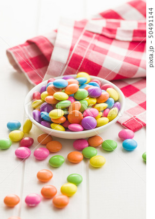 Colorful chocolate candy pills. 50491144
