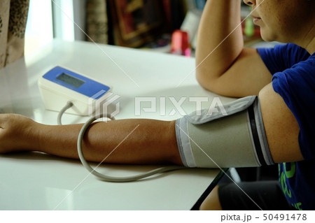 Women pressure measuring by herself. Women pressure measuring by herself. 50491478
