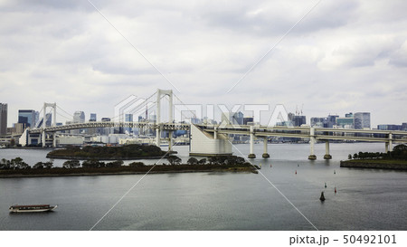 Rainbow Bridge and Tokyo Bay at Odaibacity, Japan. 50492101