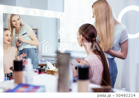 Happy beautiful woman enjoying how she looks 50492214