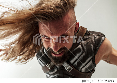 Man in cosplaying Thor isolated on white studio background Man in cosplaying Thor isolated on white studio background 50495693