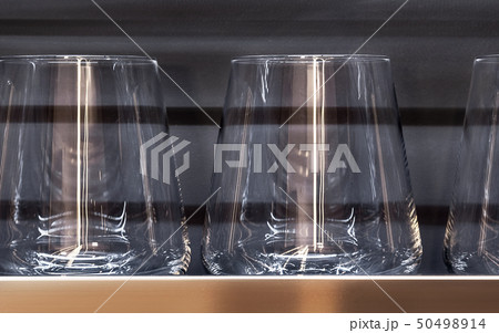 Brandy glasses and whiskey glasses closeup. Brandy glasses and whiskey glasses closeup. 50498914
