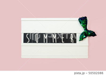 Summer - text on a display lightbox on pink bright background. 50502086