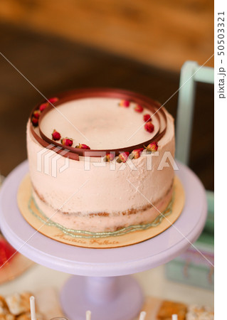 Tasty pink creamy cake with copy space. 50503321