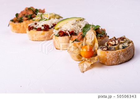 Delicious Italian antipasti bruschetta on white background. Macro. 50506343