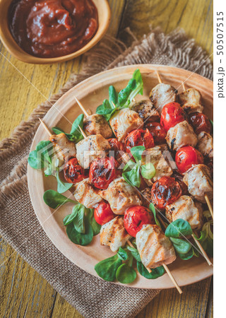 Grilled chicken skewers on the plate 50507515