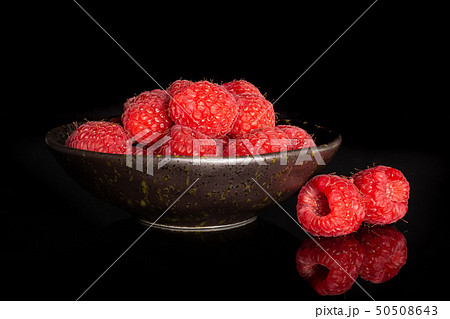 Fresh red raspberry isolated on black glass Fresh red raspberry isolated on black glass 50508643