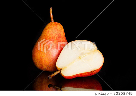 Fresh red pear isolated on black glass Fresh red pear isolated on black glass 50508749