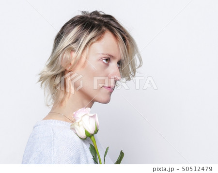 Woman with pink rose 50512479