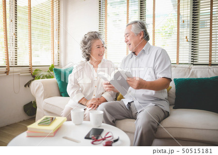 Happy senior couple reading a book together. 50515181