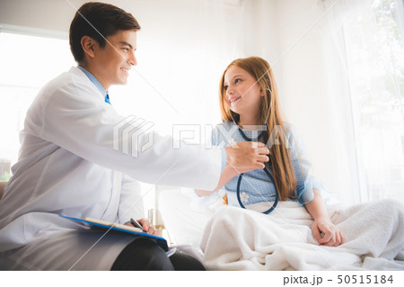 Doctor pediatrician with patient little girl. 50515184