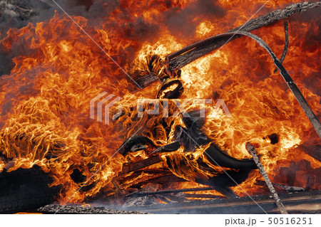 Burning cars wheels, strong flame of red fire Burning cars wheels, strong flame of red fire 50516251