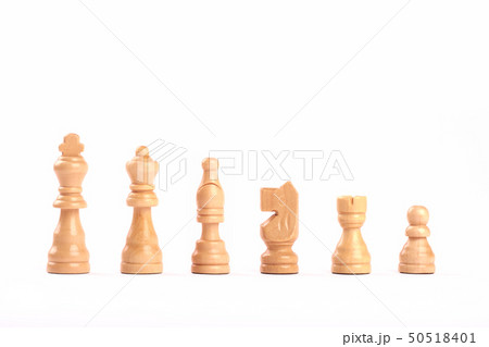 Set of white wooden chess figures in a row 50518401