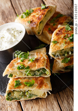 Bolani is a traditional Afghani flatbread stuffed Bolani is a traditional Afghani flatbread stuffed 50519007