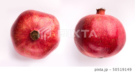 Two pomegranates isolated on white Two pomegranates isolated on white 50519149