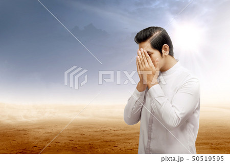 Asian muslim man standing and praying 50519595