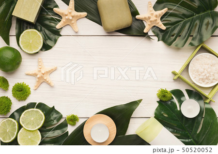 Spa background with facial mask and cream on white wood Spa background with facial mask and cream on white wood 50520052
