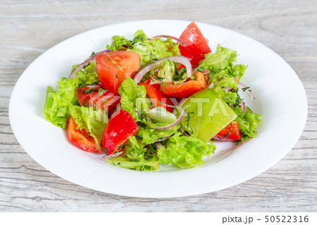 Dietary food. Plate of salad with fresh vegetables 50522316