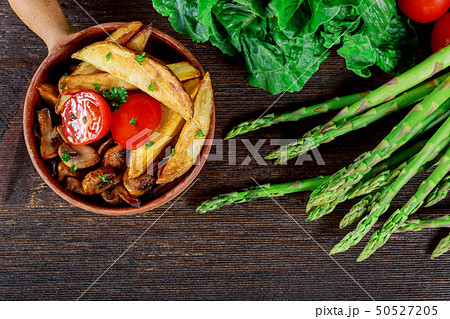 Grilled mushroom caps with fried potato Grilled mushroom caps with fried potato 50527205