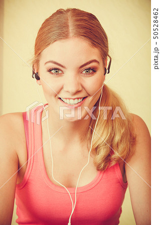 Woman with earphones listening to music. Leisure. Woman with earphones listening to music. Leisure. 50528462