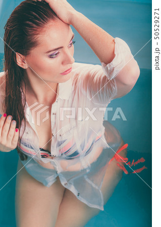 Sexy seductive woman in water. Sexy seductive woman in water. 50529271