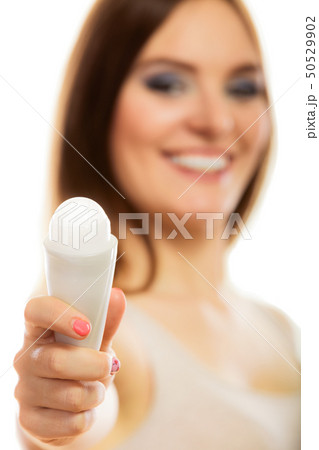Girl holding stick deodorant in hand Girl holding stick deodorant in hand 50529902