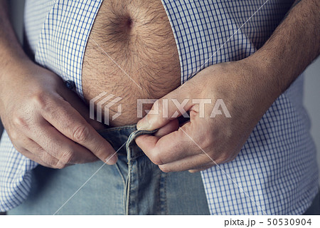 caucasian man with a pot belly caucasian man with a pot belly 50530904