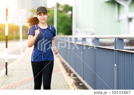 Young attractive asian runner woman running 50533867