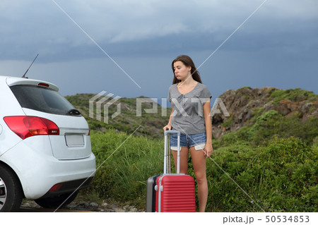 Frustrated car driver waiting for assistance after Frustrated car driver waiting for assistance after 50534853