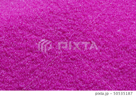 The pink pellet of raw plastic material . The pink pellet of raw plastic material . 50535187