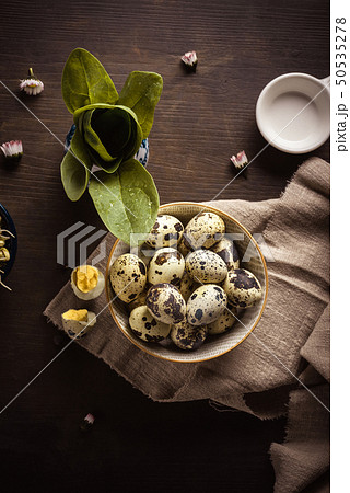 Ceramic bowl full of small spotted quail eggs on Ceramic bowl full of small spotted quail eggs on 50535278